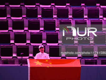 RIYADH, SAUDI ARABIA - NOVEMBER 04: A Chinese fan awaits Qinwen Zheng's match against Elena Rybakina of Kazakhstan on Day 3 of the 2024 WTA...