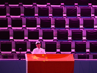 RIYADH, SAUDI ARABIA - NOVEMBER 04: A Chinese fan awaits Qinwen Zheng's match against Elena Rybakina of Kazakhstan on Day 3 of the 2024 WTA...