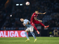 Carles Perez of Getafe CF competes for the ball with Mihailo Ristic of RC Celta de Vigo during the La Liga EA Sports match between RC Celta...