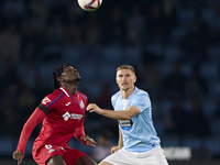 Carl Starfelt of RC Celta de Vigo competes for the ball with Christantus Uche of Getafe CF during the La Liga EA Sports match between RC Cel...