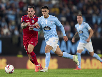 Alex Sola of Getafe CF competes for the ball with Hugo Sotelo of RC Celta de Vigo during the La Liga EA Sports match between RC Celta de Vig...