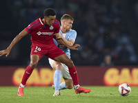 Carl Starfelt of RC Celta de Vigo competes for the ball with Alvaro Rodriguez of Getafe CF during the La Liga EA Sports match between RC Cel...