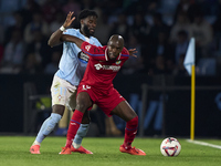 Jonathan Bamba of RC Celta de Vigo competes for the ball with Allan Nyom of Getafe CF during the La Liga EA Sports match between RC Celta de...