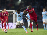 Allan Nyom of Getafe CF competes for the ball with Jonathan Bamba of RC Celta de Vigo during the La Liga EA Sports match between RC Celta de...