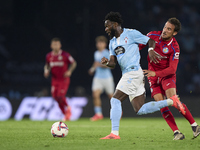 Luis Milla of Getafe CF competes for the ball with Jonathan Bamba of RC Celta de Vigo during the La Liga EA Sports match between RC Celta de...