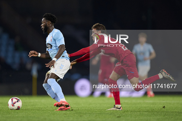 Luis Milla of Getafe CF competes for the ball with Jonathan Bamba of RC Celta de Vigo during the La Liga EA Sports match between RC Celta de...