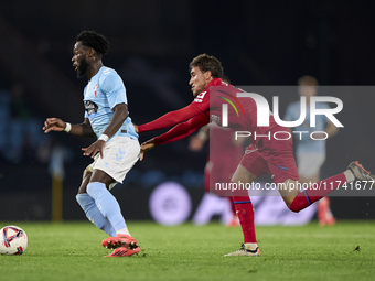 Luis Milla of Getafe CF competes for the ball with Jonathan Bamba of RC Celta de Vigo during the La Liga EA Sports match between RC Celta de...