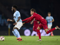 Luis Milla of Getafe CF competes for the ball with Jonathan Bamba of RC Celta de Vigo during the La Liga EA Sports match between RC Celta de...