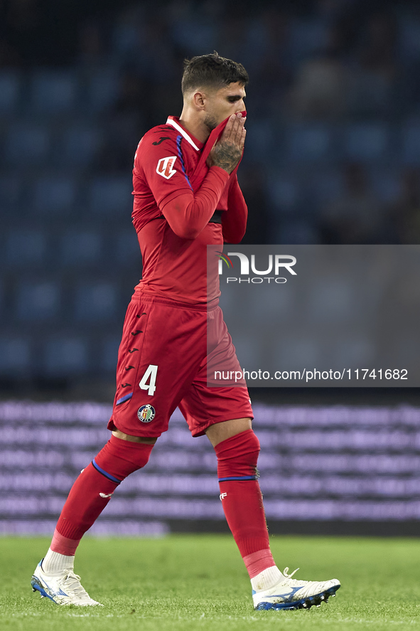 Juan Berrocal of Getafe CF leaves the pitch after receiving a red card during the La Liga EA Sports match between RC Celta de Vigo and Getaf...