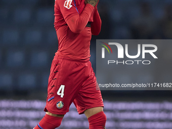 Juan Berrocal of Getafe CF leaves the pitch after receiving a red card during the La Liga EA Sports match between RC Celta de Vigo and Getaf...