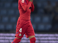 Juan Berrocal of Getafe CF leaves the pitch after receiving a red card during the La Liga EA Sports match between RC Celta de Vigo and Getaf...