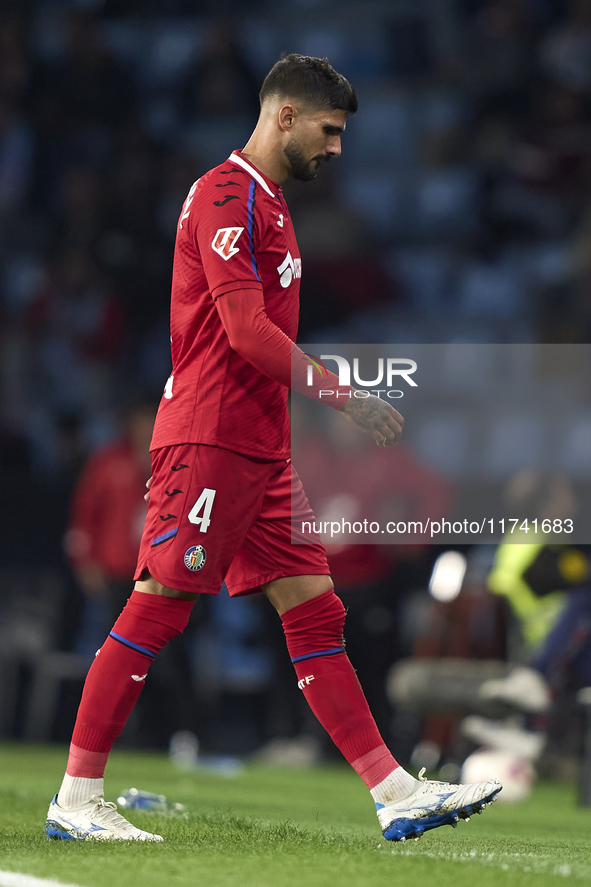 Juan Berrocal of Getafe CF leaves the pitch after receiving a red card during the La Liga EA Sports match between RC Celta de Vigo and Getaf...