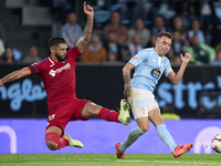 Omar Alderete of Getafe CF competes for the ball with Iago Aspas of RC Celta de Vigo during the La Liga EA Sports match between RC Celta de...