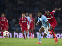 Allan Nyom of Getafe CF competes for the ball with Jonathan Bamba of RC Celta de Vigo during the La Liga EA Sports match between RC Celta de...