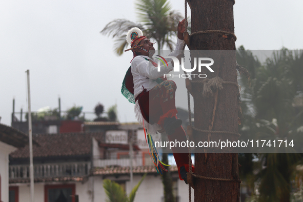 The Voladores of Cuetzalan perform a pre-Hispanic ritual ceremony that involves tying their feet with ropes and launching themselves into th...