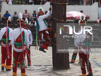 The Voladores of Cuetzalan perform a pre-Hispanic ritual ceremony that involves tying their feet with ropes and launching themselves into th...