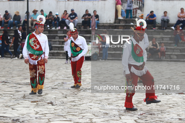 The Voladores of Cuetzalan perform a pre-Hispanic ritual ceremony that involves tying their feet with ropes and launching themselves into th...