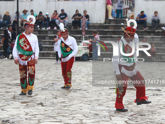 The Voladores of Cuetzalan perform a pre-Hispanic ritual ceremony that involves tying their feet with ropes and launching themselves into th...