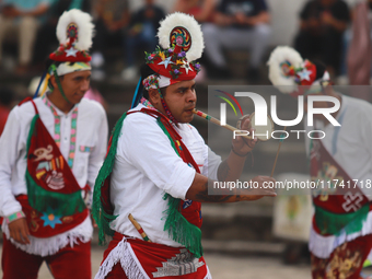 The Voladores of Cuetzalan perform a pre-Hispanic ritual ceremony that involves tying their feet with ropes and launching themselves into th...