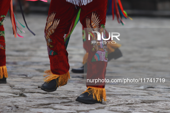 The Voladores of Cuetzalan perform a pre-Hispanic ritual ceremony that involves tying their feet with ropes and launching themselves into th...