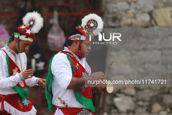 The Voladores of Cuetzalan perform a pre-Hispanic ritual ceremony that involves tying their feet with ropes and launching themselves into th...