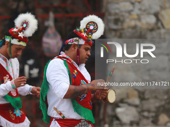 The Voladores of Cuetzalan perform a pre-Hispanic ritual ceremony that involves tying their feet with ropes and launching themselves into th...