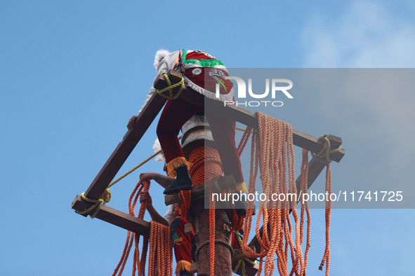 The Voladores of Cuetzalan perform a pre-Hispanic ritual ceremony that involves tying their feet with ropes and launching themselves into th...