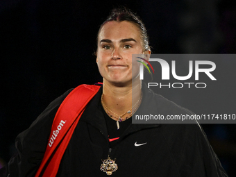 RIYADH, SAUDI ARABIA - NOVEMBER 04: Aryna Sabalenka of Belarus, wearing a tiger-themed brooch, seen after her match against Jasmine Paolini...