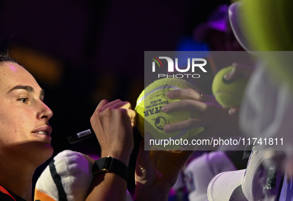 RIYADH, SAUDI ARABIA - NOVEMBER 04: Aryna Sabalenka of Belarus signs autographs for her fans after her match against Jasmine Paolini of Ital...