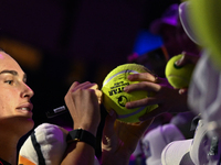 RIYADH, SAUDI ARABIA - NOVEMBER 04: Aryna Sabalenka of Belarus signs autographs for her fans after her match against Jasmine Paolini of Ital...