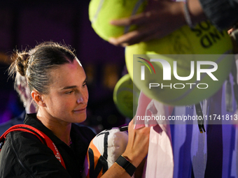 RIYADH, SAUDI ARABIA - NOVEMBER 04: Aryna Sabalenka of Belarus signs autographs for her fans after her match against Jasmine Paolini of Ital...