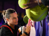 RIYADH, SAUDI ARABIA - NOVEMBER 04: Aryna Sabalenka of Belarus signs autographs for her fans after her match against Jasmine Paolini of Ital...