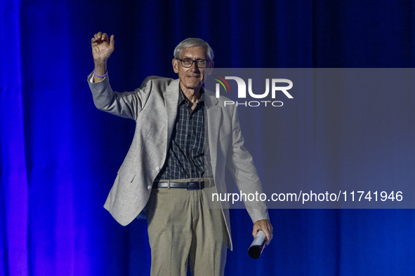 Wisconsin Governor Tony Evers is welcomed by the crowd at a campaign event for the Minnesota Governor in Milwaukee, Wisconsin, on november 0...