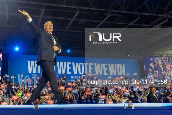 Minnesota Governor and Democratic VP candidate Tim Walz is welcomed by the crowd in Milwaukee, Wisconsin, on november 04, 2024. 