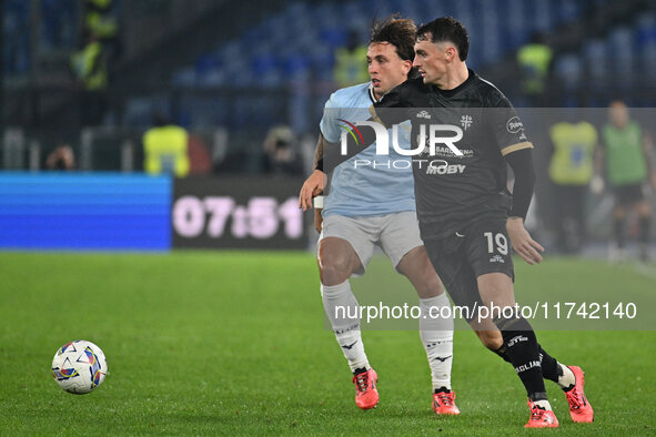 Luca Pellegrini of S.S. Lazio and Nadir Zortea of Cagliari Calcio are in action during the 11th day of the Serie A Championship between S.S....