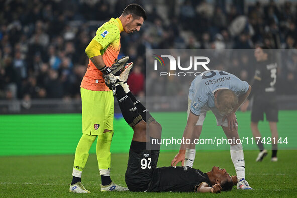 Simone Scuffet, Yerry Mina of Cagliari Calcio, and Gustav Isaksen of S.S. Lazio are in action during the 11th day of the Serie A Championshi...