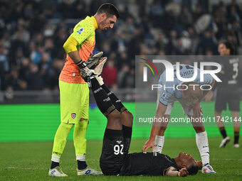 Simone Scuffet, Yerry Mina of Cagliari Calcio, and Gustav Isaksen of S.S. Lazio are in action during the 11th day of the Serie A Championshi...