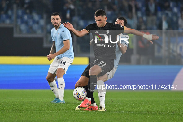 Roberto Piccoli of Cagliari Calcio and Alessio Romagnoli of S.S. Lazio are in action during the 11th day of the Serie A Championship between...