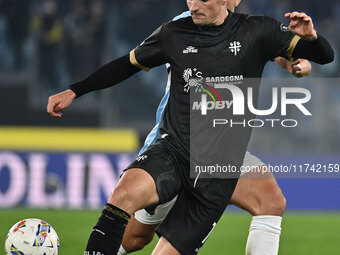 Nadir Zortea of Cagliari Calcio and Luca Pellegrini of S.S. Lazio are in action during the 11th day of the Serie A Championship between S.S....