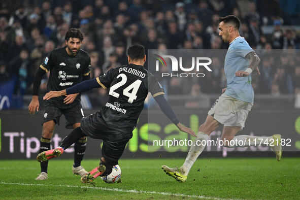 Jose Luis Palomino of Cagliari Calcio and Matias Vecino of S.S. Lazio are in action during the 11th day of the Serie A Championship between...