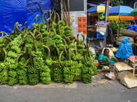 Bunches of unripe bananas are for sale at a marketplace ahead of the Chhath Puja celebration in Kolkata, India, on November 5, 2024. (