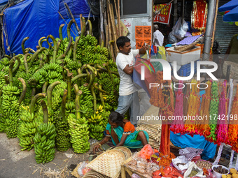 Bunches of unripe bananas are for sale at a marketplace ahead of the Chhath Puja celebration in Kolkata, India, on November 5, 2024. (