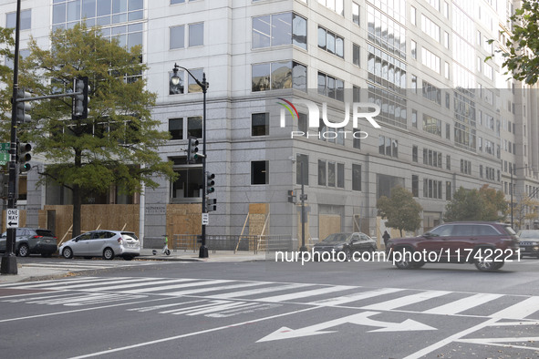 A store is boarded up with plywood fencing in Washington DC, United States, on November 4, 2024, ahead of the Presidential Election. 