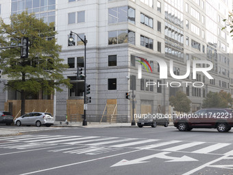 A store is boarded up with plywood fencing in Washington DC, United States, on November 4, 2024, ahead of the Presidential Election. (