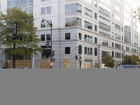 A store is boarded up with plywood fencing in Washington DC, United States, on November 4, 2024, ahead of the Presidential Election. (