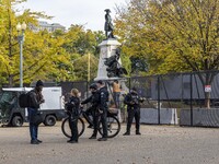 Workers erect security fences surrounding the construction site for the 2025 Presidential Inaugural Parade Reviewing Stand in Lafayette Squa...