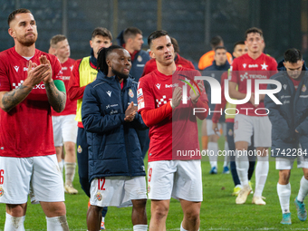 Alan Uryga, James Igbekeme, and Angel Rodado stand after the game between Wisla Krakow and GKS Tychy in Krakow, Poland, on November 4, 2024....