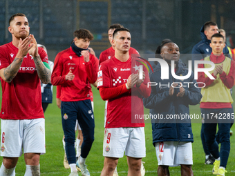 Alan Uryga, James Igbekeme, and Angel Rodado stand after the game between Wisla Krakow and GKS Tychy in Krakow, Poland, on November 4, 2024....