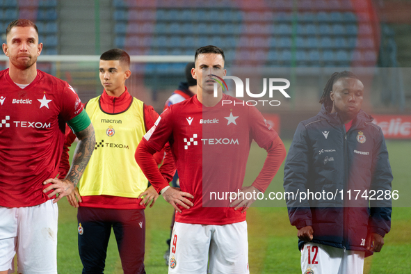 Alan Uryga, James Igbekeme, and Angel Rodado stand after the game between Wisla Krakow and GKS Tychy in Krakow, Poland, on November 4, 2024....