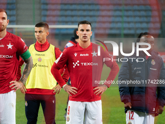 Alan Uryga, James Igbekeme, and Angel Rodado stand after the game between Wisla Krakow and GKS Tychy in Krakow, Poland, on November 4, 2024....